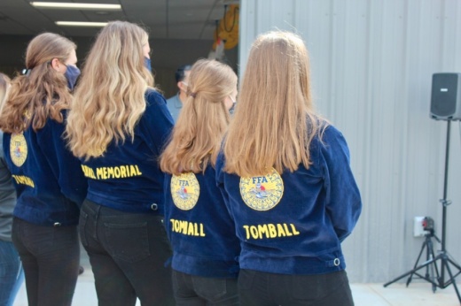 Several FFA students from Tomball Memorial and Tomball high schools attended the ribbon-cutting with district leadership Sept. 4. (Anna Lotz/Community Impact Newspaper)