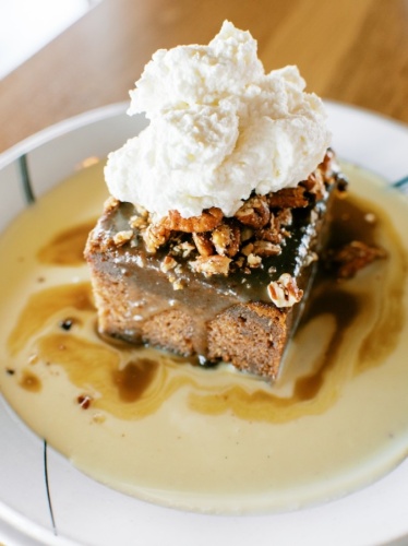 The namesake Whiskey Cake features a toffee torte topped with bourbon anglaise, spiced pecans and whipped cream. (Courtesy Whiskey Cake)