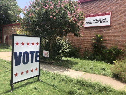A sign directs voters inside at Ridgetop Elementary School during the July 14 elections in Austin. Historically, AISD campuses have been used as Travis County polling locations for elections. (Jack Flagler/Community Impact Newspaper) 