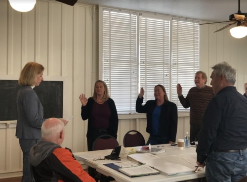 State Rep. Vikki Goodwin (left), D-Austin, swears in the newly elected directors of the Southwest Travis County Groundwater Conservation District on Nov. 15. (Amy Rae Dadamo/Community Impact Newspaper)