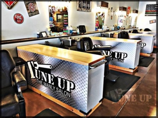 Both locations specialize in men's haircuts, shaves and waxing, and they also offer complimentary alcoholic drinks. (Courtesy Tune Up: The Manly Salon)