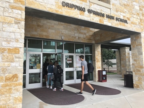 Photo of students entering Dripping Springs High School with masks on