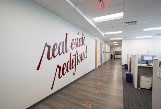 The real estate brokerage opened its Frisco office at Hall Park in June 2019. (Courtesy Redfin)