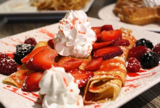 The Berry Blast Crepes ($9.99) feature crepes topped with berries and whipped cream.  (Ian Pribanic/Community Impact Newspaper)