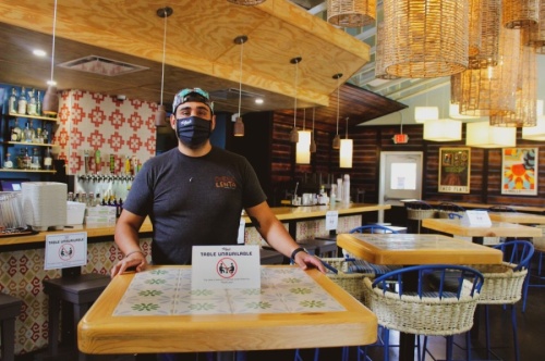 Simon Madera, owner of Taco Flats, said business is down 40% across the board but that he has readjusted the business model to stay afloat in the pandemic long term. (Christopher Neely/Community Impact Newspaper)