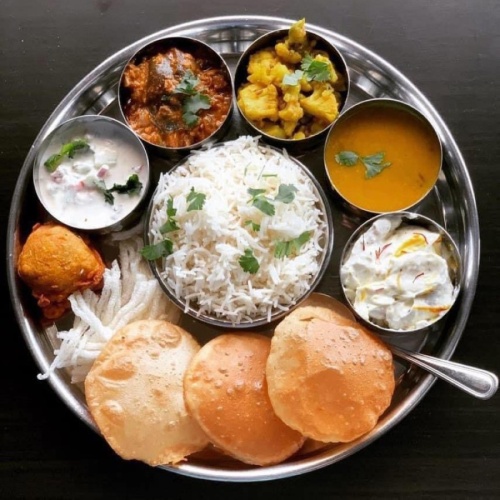 Thali $12.99: Thali translates to plate and is a round platter that includes curry, vegetables and rice. 
(Courtesy Megha Ozarker)
