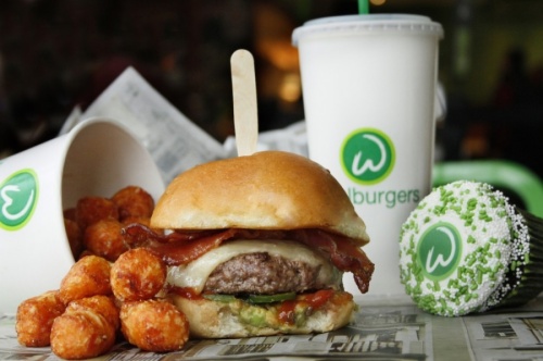 The BBQ bacon burger at Wahlburgers is topped with white cheddar cheese, bacon, avocado, jalapeños and barbecue sauce. (Courtesy Wahlburgers)