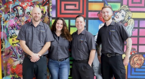 Kraken Motorsports is a mechanic and performance shop owned by Alicia and Shawn Rizzo, pictured in the center. Team members also include Josh Duncan and Phillip MacPherson. (Courtesy Kraken Motorsports)