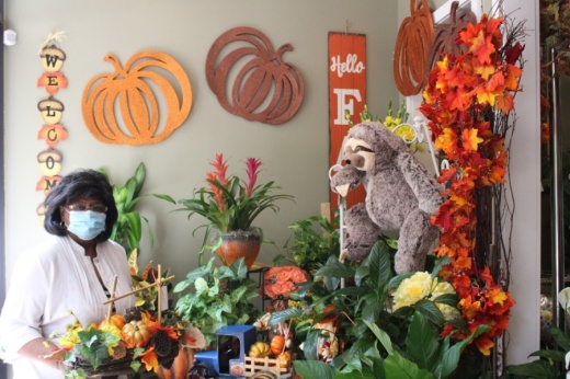 House of Blooms owner Pat Houck showcases her fall arrangements in the flower shop's front entrance. (Claire Shoop/Community Impact Newspaper)