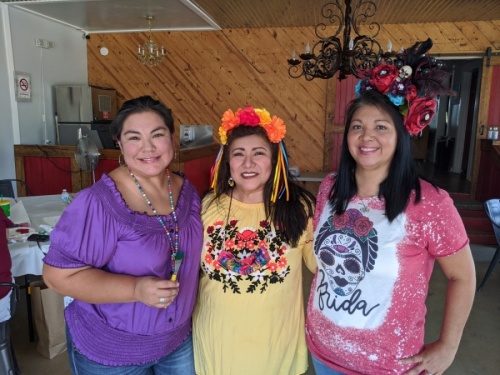 From left: Tanya Perez, Mary Ann Labowski and Shelley Bujnoch gathered for the Día de los Muertos painting party. (Lauren Canterberry/Community Impact Newspaper)