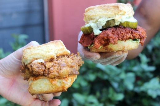 The Queen Beak (left, $9) is available all day and is made with a fried chicken breast, cayenne black pepper honey and bacon-infused chipotle mayo. The firebird ($10, dinner-only) is a hot chicken sandwich with goat cheese and dil aioli, spicy sweet pickles and cilantro. (Jack Flagler/Community Impact Newspaper)