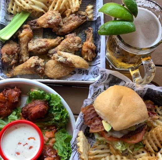 The eatery serves 18 types of wing seasonings and dressings as well as burgers, waffles and loaded baked potatoes. (Courtesy Big City Wings)