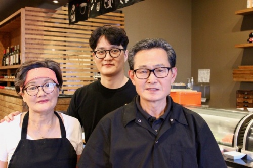From left: Okhwan Han serves as co-owner; Hyukki Soon, as manager; and Youngho Soon, as co-owner of Miso. (Taylor Jackson Buchanan/Community Impact Newspaper)