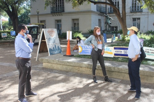 José Garza, left, and his campaign manager, Alexa Etheredge, speak to voters at the University of Texas campus Nov. 3. (Jack Flagler/Community Impact Newspaper)