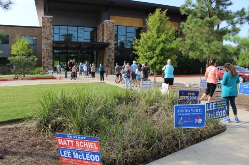 Residents wait outside the Lone Star College-Creekside Center during the early voting period. (Ben Thompson/Community Impact Newspaper)