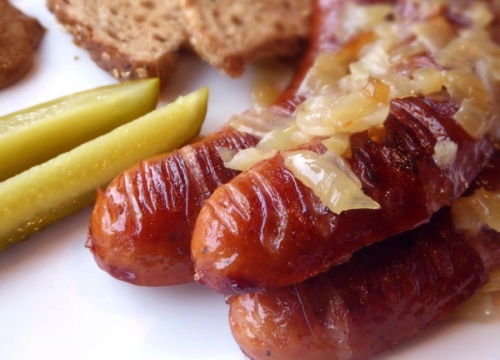 A popular dish at European in Texas Market Cafe in Southlake, the Polish sausage ($9.99) is cooked with sautéed onions and is served with mustard, ketchup, a side of bread and a pickle.  (Courtesy European in Texas Market Cafe)