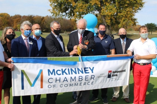 Officials with the Salesmanship Club of Dallas and the McKinney Chamber of Commerce cut the ribbon on the AT&T Byron Nelson Tournament's planned move to TPC Craig Ranch in McKinney. (William C. Wadsack/Community Impact Newspaper)