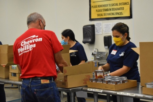 Helping at the food bank is just one way to give back to the community. (Courtesy Montgomery County Food Bank)