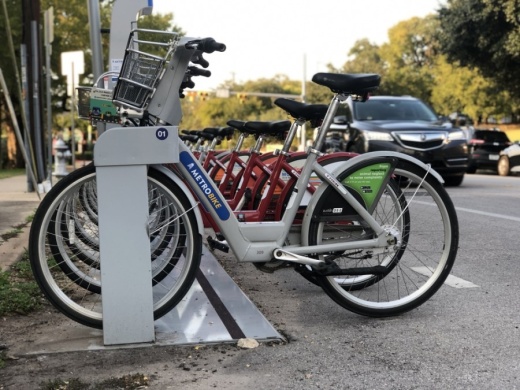 Bicycles for public use are docked at a MetroBike station on Lake Austin Boulevard. Austin's $460 million Proposition B will include funding for additional bicycle lanes through the city. (Jack Flagler/Community Impact Newspaper) 