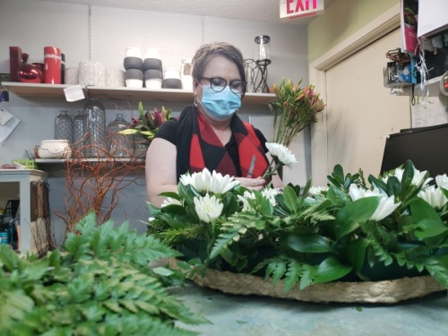 Deniese O’Neill, owner of The Flower Box flower shop located near the Georgetown Public Library, calls herself an “ordained florist.” (Ali Linan/Community Impact Newspaper)