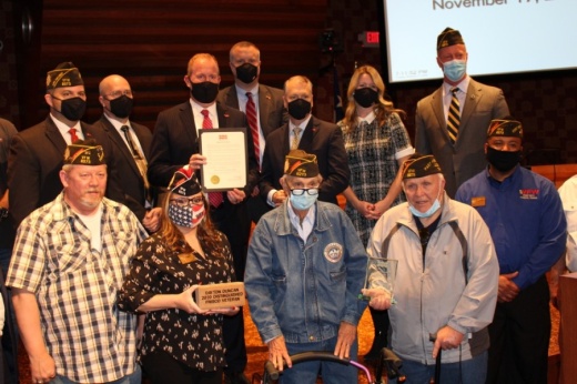 The city of Frisco recognized Dayton Duncan, front row, third from left, as the 2020 Distinguished Veteran of the Year during a Nov. 17 City Council meeting. (William C. Wadsack/Community Impact Newspaper)
