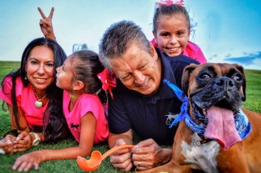 Manuel Buchanan, owner and operator of K9 PW Training and Boarding, is joined by his wife and two daughters when training dogs. (Courtesy K9 PW Training and Boarding)