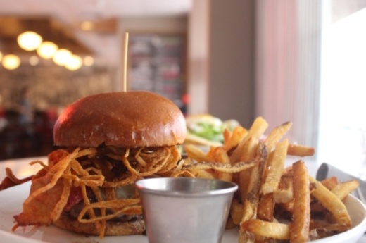 The Society Burger at The League Kitchen & Tavern is ground in house and priced at $11.99. (Amy Rae Dadamo/Community Impact Newspaper)