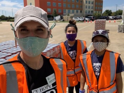 Cy-Hope staff and volunteers help distribute food in partnership with the Houston Food Bank at the Houston Premium Outlets. (Courtesy Cy-Hope)