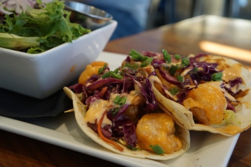 Shrimp tacos are offered at Muck & Fuss. (Lauren Canterberry/Community Impact Newspaper)