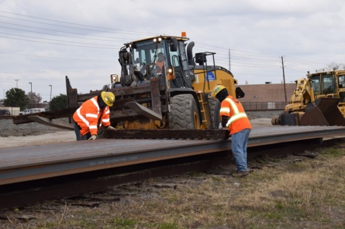 The 200 rail pieces—adding up to 16,000 feet of rail—were delivered east of Shiloh Road and unloaded near existing tracks, according to a Dec. 18 DART release. (Courtesy Dallas Area Rapid Transit)