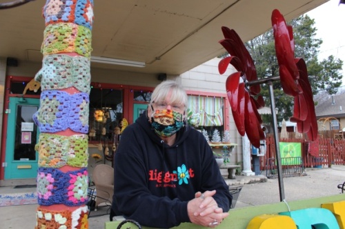 Tracey Collins, the owner of Diggin' It, said her friend knitted the decorations on her left. (Francesca D'Annunzio/Community Impact Newspaper)