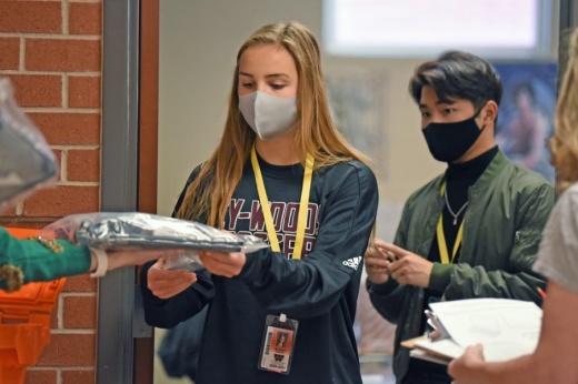 A Cypress Woods High School student receives a Chromebook in December. (Courtesy Cy-Fair ISD)