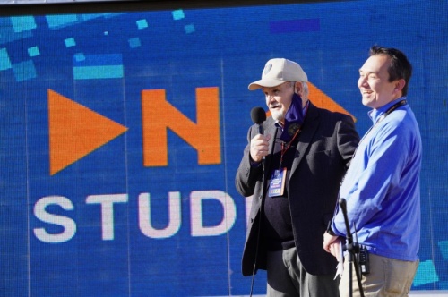 Humble Mayor Merle Aaron speaks to a crowd while CEO of DNA Studios Sam Schrade smiles during the groundbreaking ceremony. (Courtesy DNA Studios LLC)