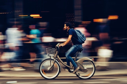 Man riding bike in city