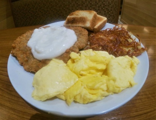 Chicken-fried steak and eggs ($11.99) are served with hash browns and Texas toast. (Courtesy The Cottage)