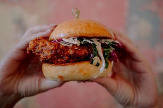 The Austin-based eatery's menu is inspired by Nashville hot chicken; offerings include chicken bites, jumbo tenders, chicken sandwiches, macaroni and cheese, collard greens and homemade pies. (Courtesy Tumble 22)