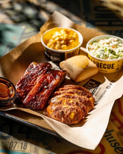 The Texas barbecue franchise, which is celebrating its 80th anniversary this year, offers a variety of barbecue plates and sandwiches and boasts fall-off-the-bone ribs and pit-smoked wings. (Courtesy Dickey's BBQ)