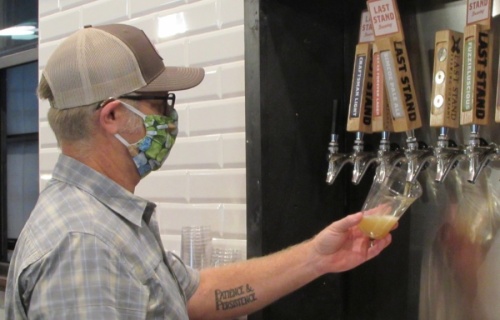 Last Stand Brewing Co. owner Jim Sampson pours a beer at the business's new South Austin brewery.  (Nicholas Cicale/Community Impact Newspaper)