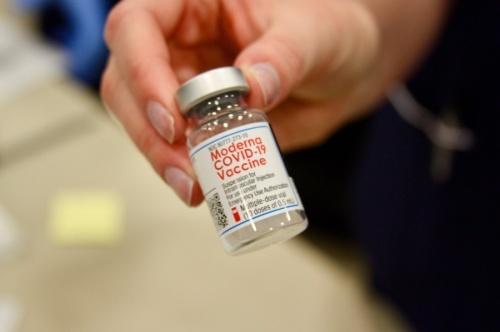 Hannah Sullivan, a student at Galen College of Nursing, holds a vial of the Moderna COVID-19 vaccine. (Lauren Canterberry/Community Impact Newspaper) 