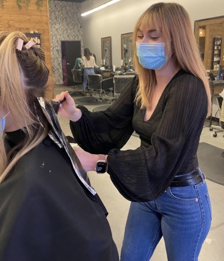 Salon stylist Bri Bromley colors hair at Salt and Waves Salon in Leander. (Courtesy Salt and Waves Salon)