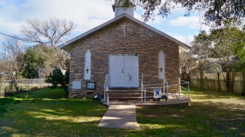 Off Sheppard Street in Round Rock lies a one-room white church, with etchings of its founders’ names carved into marble to the left of the front door. Centered in the heart of the city, St. Paul African Methodist Episcopal Church traces its origin back more than 135 years. (Kelsey Thompson/Community Impact Newspaper)