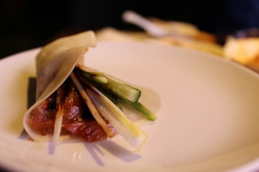Peking duck is traditionally eater in a housemade pancake wrap with a special duck sauce and shredded onion and cucumber. (Shawn Arrajj/Community Impact Newspaper)