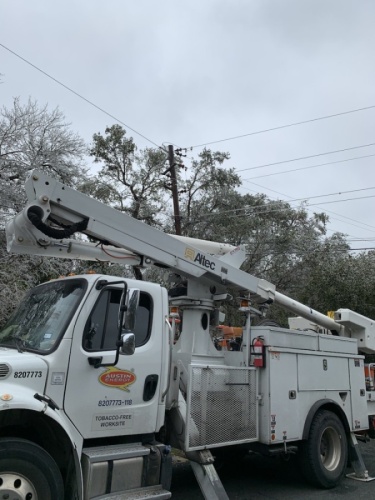 Austin Energy crews were in the Apache Shores neighborhood Feb. 12 to remove tree limbs from power lines. (Greg Perliski/Community Impact Newspaper)