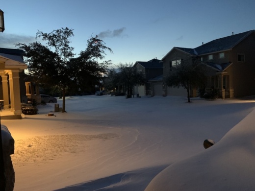 Sunrise on Feb. 15 revealed unusual amounts of snow had fallen overnight in western Travis County. Unprecedented cold temperatures and high demand for electricity has led the Pedernales Electric Cooperative to ask customers to reduce energy usage. (Greg Perliski/Community Impact Newspaper).
