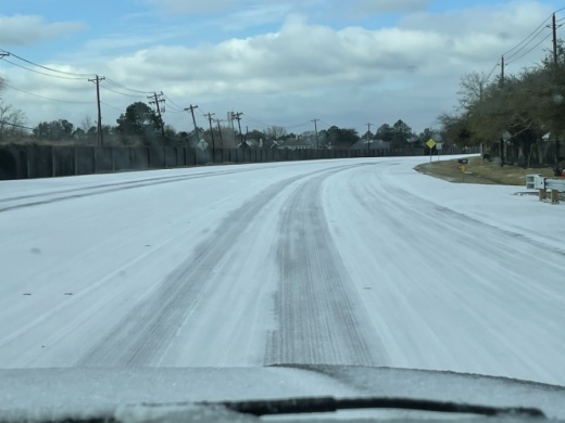 This morning, Parkwood Avenue in Friendswood saw a thin blanket of snow. (Courtesy Alison Daniel)