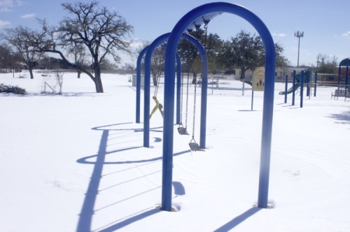 Snow covers the playground at Pecan Springs Elementary School in Austin ISD Feb. 15. (Jack Flagler/Community Impact Newspaper)