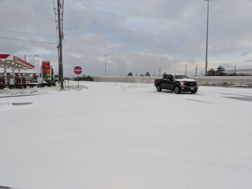 South of the city of Tomball, the Hwy. 249 frontage roads were covered in snow in the early hours of Feb. 15 in the Northpointe area. (Anna Lotz/Community Impact Newspaper)