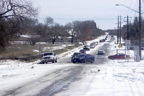 Traffic backed up on 51st Street in East Austin after a car was unable to pass through icy conditions. (Jack Flagler/Community Impact Newspaper)