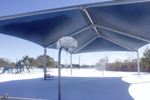 Snow covers the playground at Pecan Springs Elementary School in Austin ISD on Feb. 15. (Jack Flagler/Community Impact Newspaper)