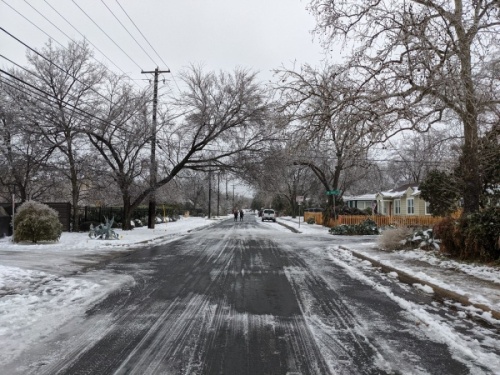 A residential road in Central Austin remains covered in snow and ice the morning of Feb. 17. (Iain Oldman/Community Impact Newspaper)